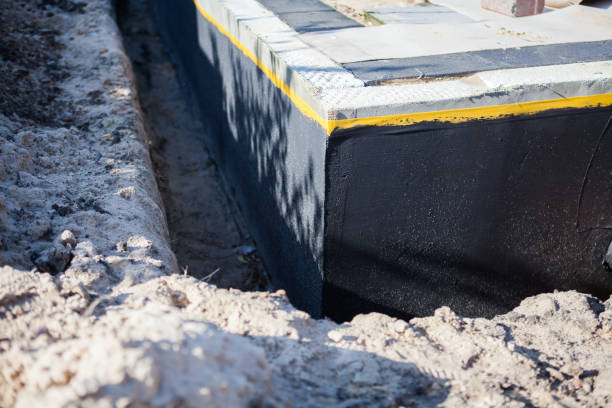 Professional Waterproofing technician working in Walton, KS